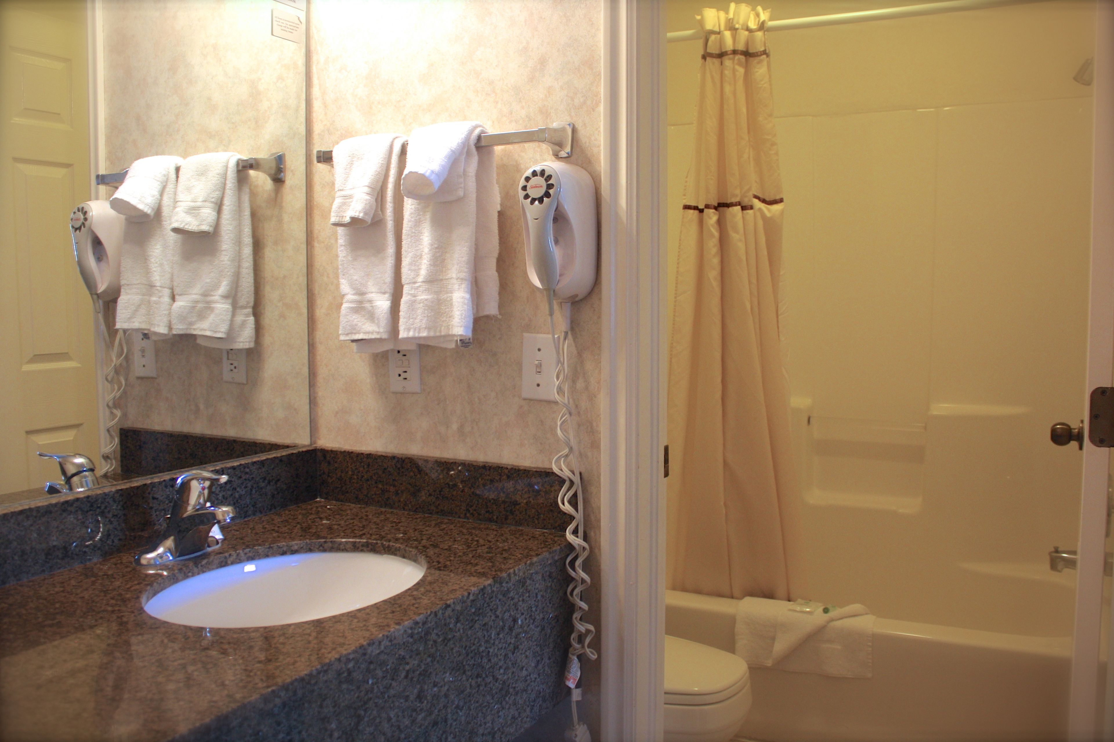 room, 2 queen beds | bathroom | combined shower/bathtub, free toiletries, hair dryer, towels