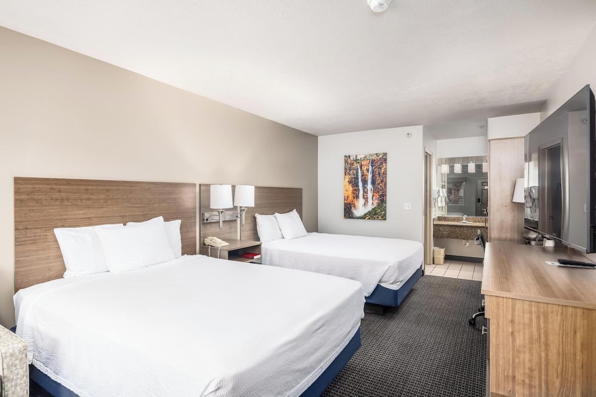 Room, 2 Queen Beds | Desk, iron/ironing board, cribs (free), WiFi (free)