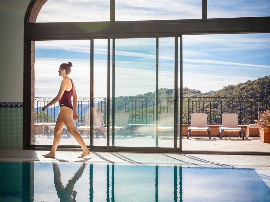 Indoor pool, a waterfall pool, pool loungers