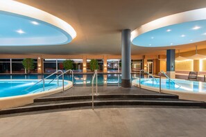 4 indoor pools, outdoor pool, open 7:00 AM to 9:00 PM, pool loungers