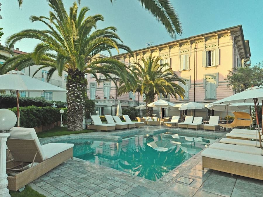 Seasonal outdoor pool, open 8:00 AM to 7:00 PM, pool umbrellas