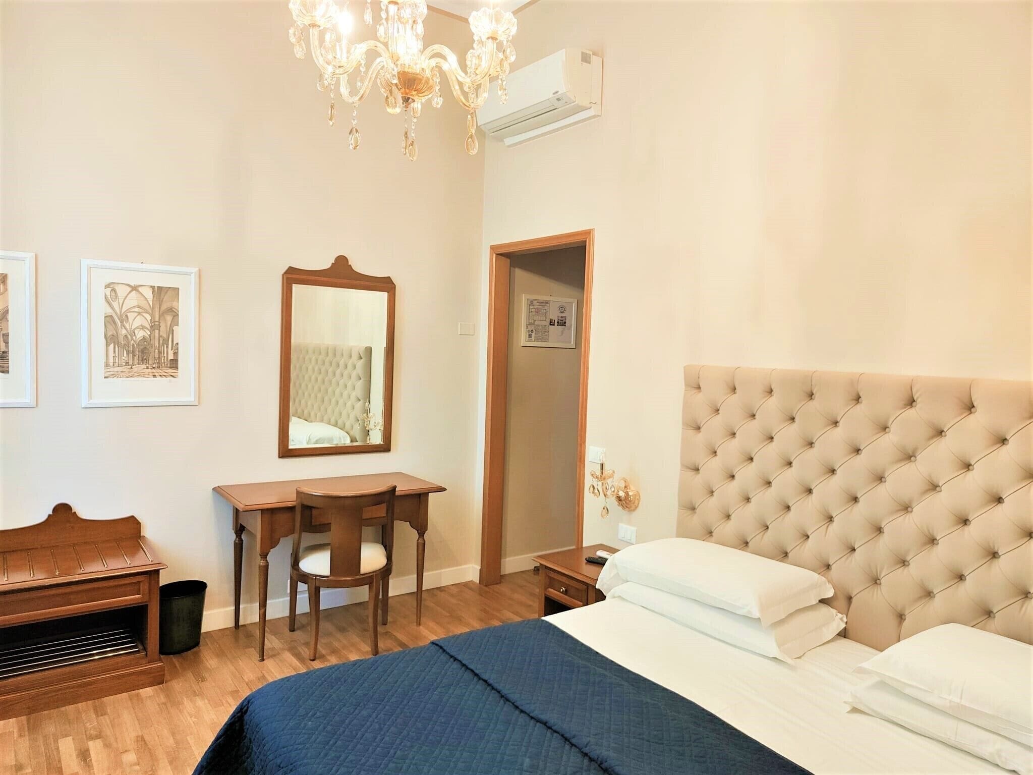 economy double room | minibar, in-room safe, desk, iron/ironing board