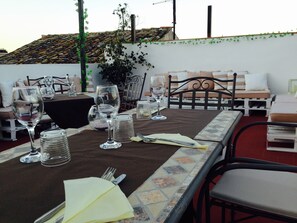 Enjoy meals in this dining area with a long table, comfortable chairs, and a bench.