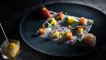 A plate of food with various colorful ingredients.