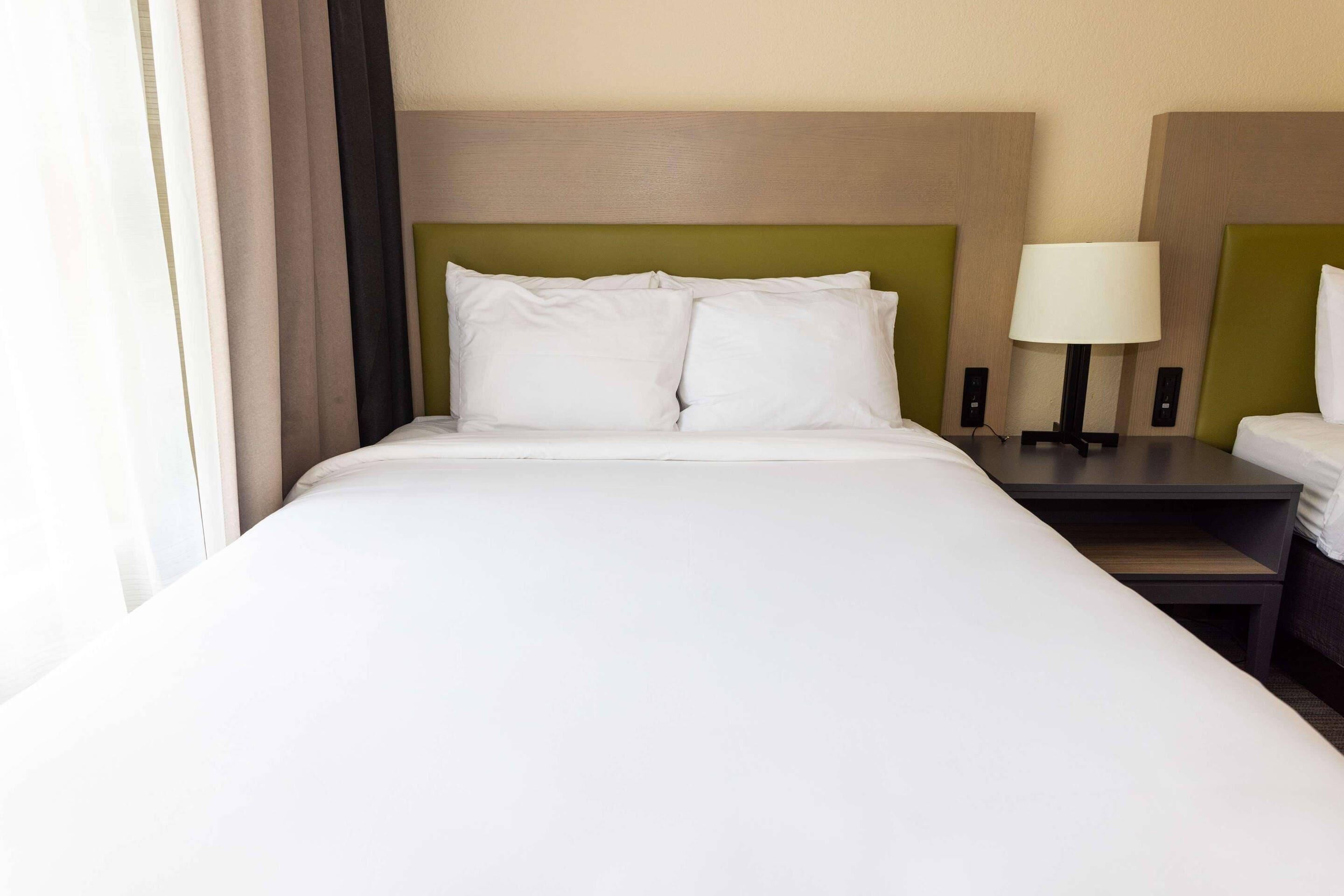 Premium bedding, down comforters, in-room safe, desk