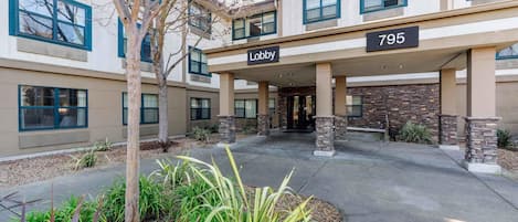 A building with a sign reading 'Lobby' and the number '795' above the entrance.