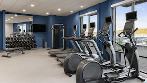 A gym with treadmills, elliptical machines, and weightlifting equipment. - Hampton Inn & Suites Bremerton (Bremerton)
