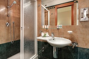 Shower, free toiletries, hair dryer, slippers