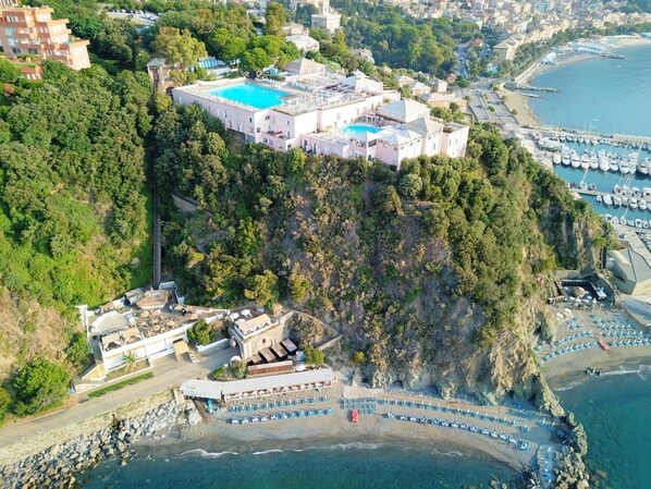 2 outdoor pools, open 9 AM to 7 PM, pool umbrellas, pool loungers