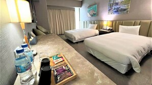 A hotel room with a bed, a desk with a lamp, a chair, a nightstand, and a window with curtains. There are also two paintings on the wall. - Kaohsiung Ahotel (Kaohsiung)