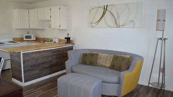 Desk, laptop workspace, blackout drapes, iron/ironing board