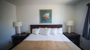 Desk, laptop workspace, blackout drapes, iron/ironing board