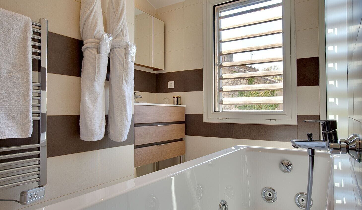 deluxe room | bathroom | hair dryer, bathrobes, slippers, towels