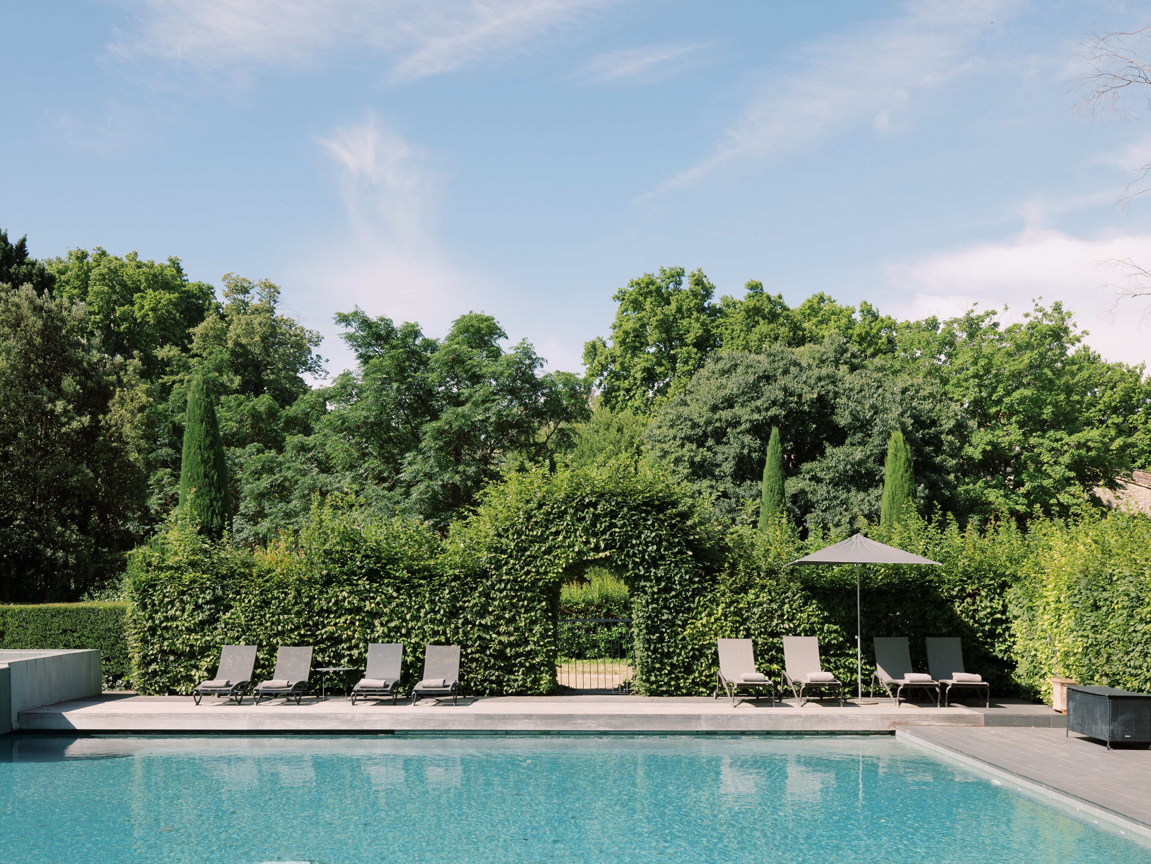 indoor pool, outdoor pool, pool umbrellas, pool loungers