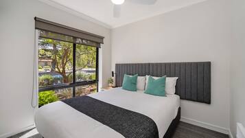 Premium bedding, individually furnished, desk, laptop workspace