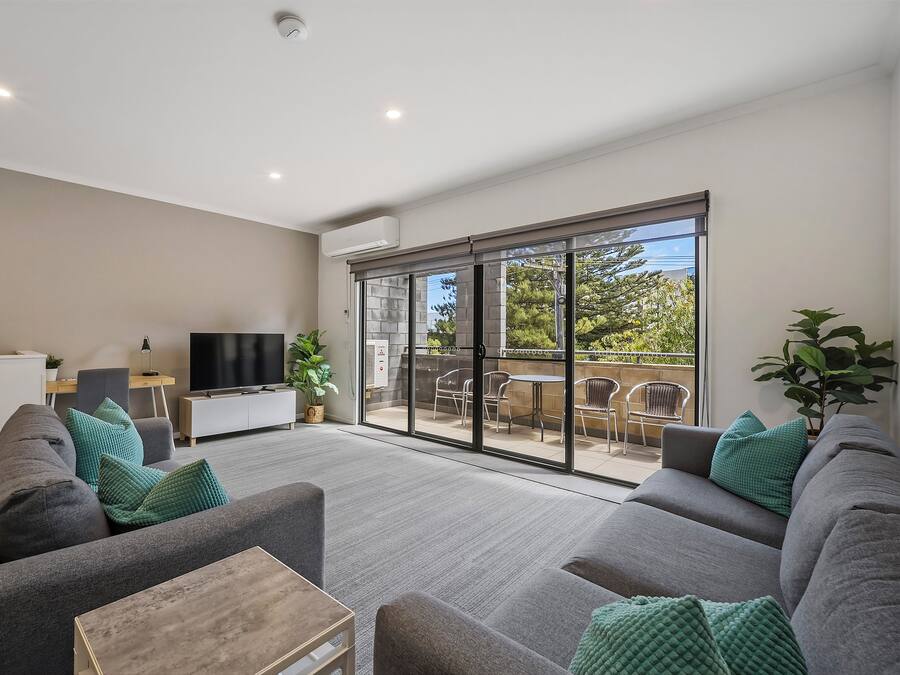 Executive Three Bedroom Townhome | Living area | 43-inch LED TV with digital channels, TV, Netflix