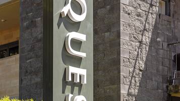 A building with a sign that reads 'QUEST' in large letters.