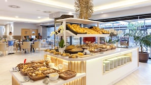 A buffet area with various food items and a seating area in the background. - Gran Tacande Wellness & Relax Costa Adeje (Adeje)