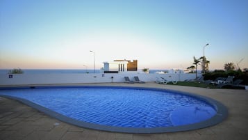Indoor pool, seasonal outdoor pool, open 9 AM to 8 PM, pool umbrellas