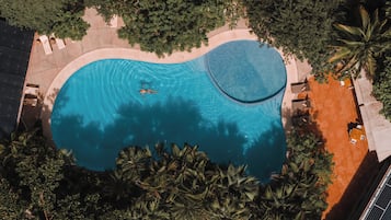 Outdoor pool, open 9:00 AM to 9:00 PM, free pool cabanas, pool loungers