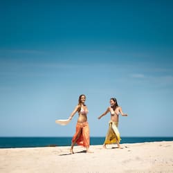 On the beach, white sand, sun loungers, beach towels