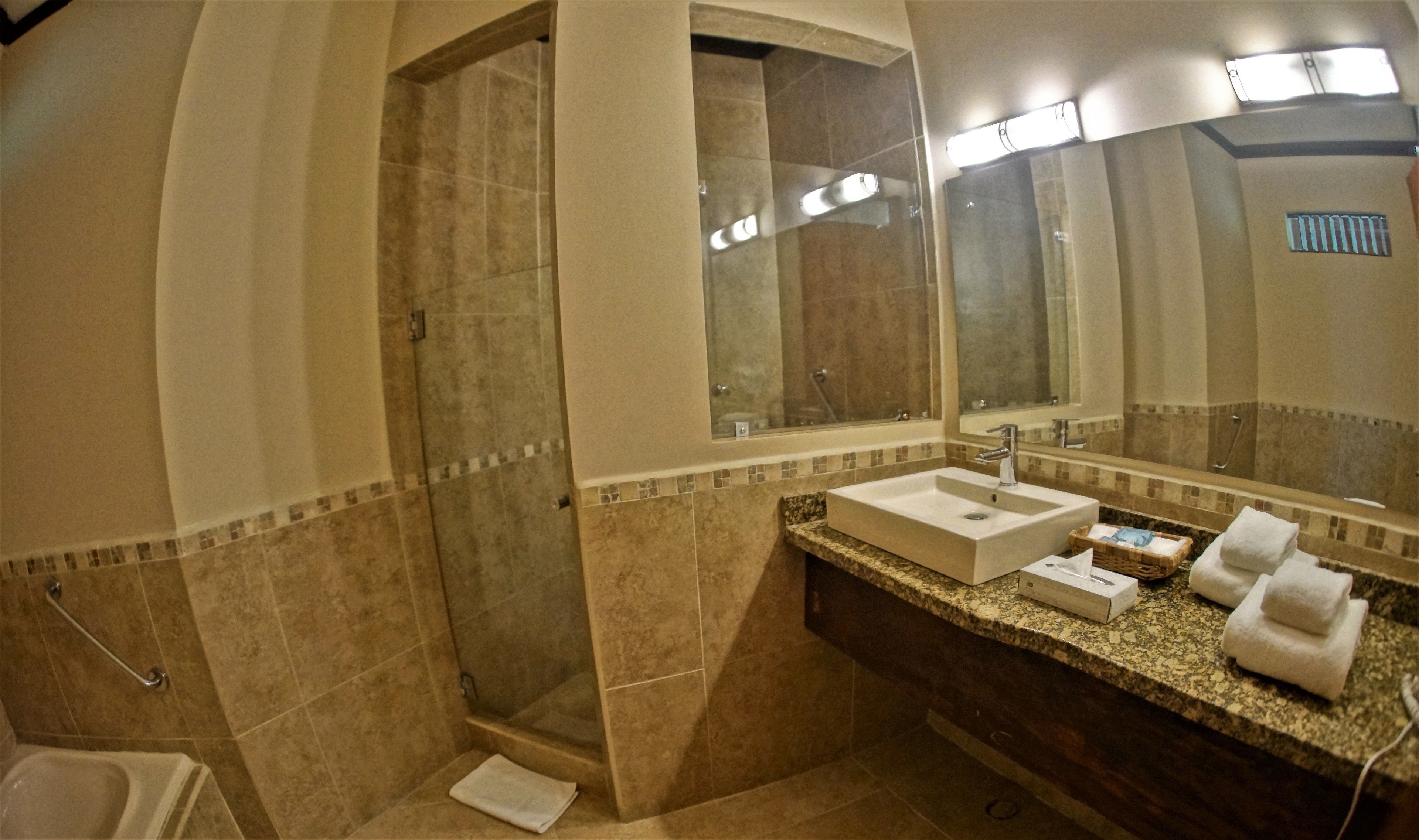 separate bathtub and shower, eco-friendly toiletries, hair dryer, towels