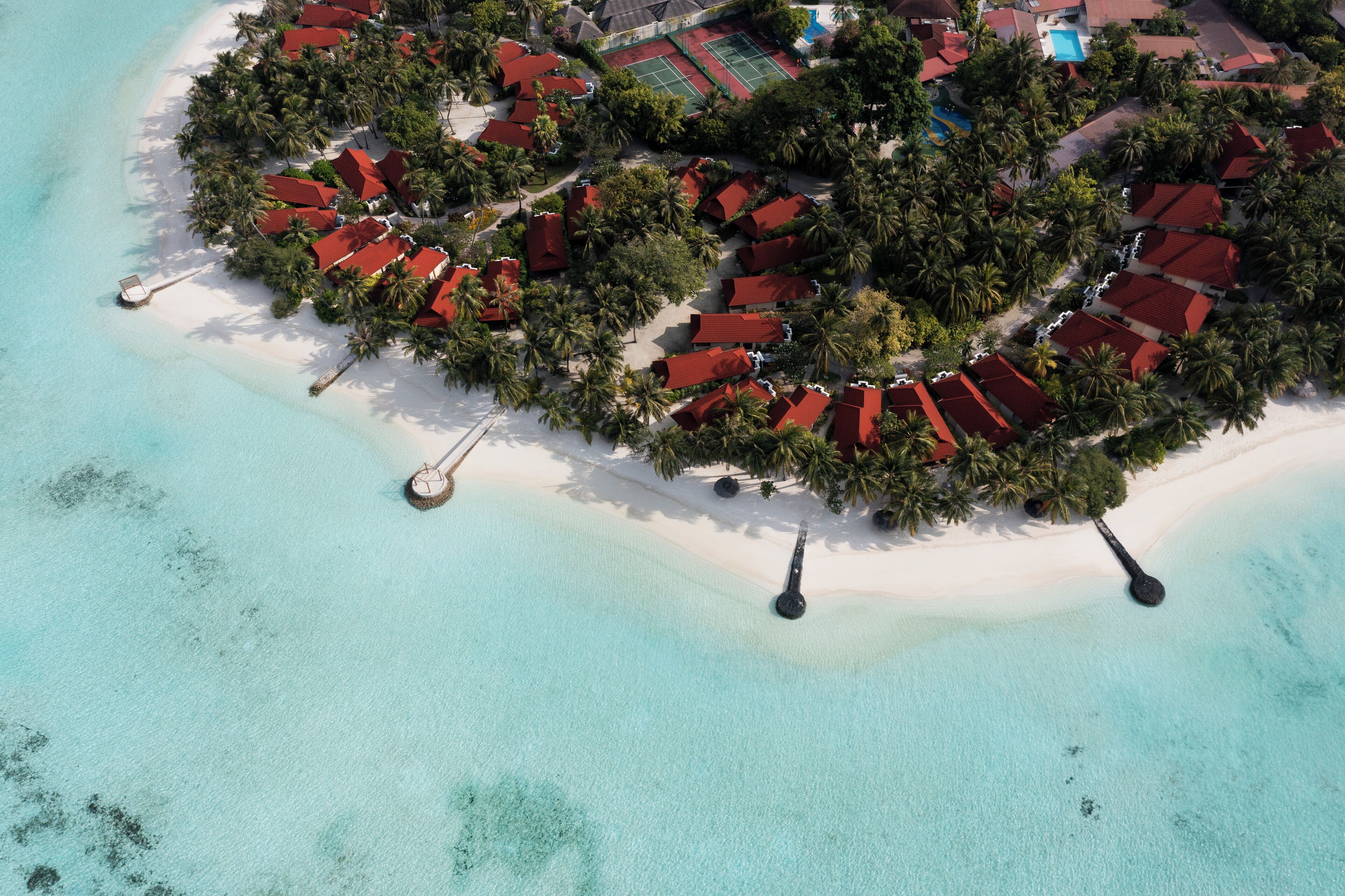 On the beach, white sand, beach towels, beach massages