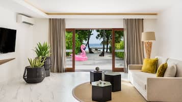 Villa familiar | Área de sala de estar | Televisión LCD, reproductor de DVD, tenis de mesa y juguetes
