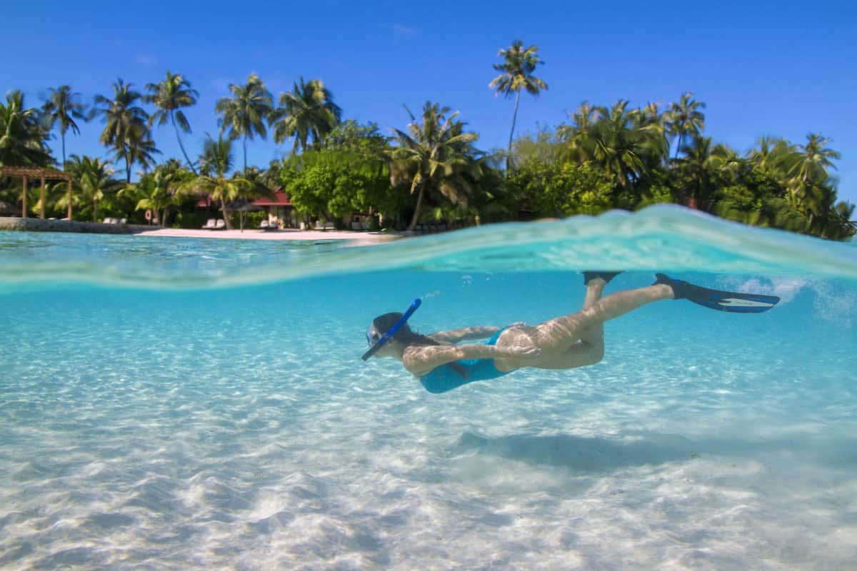 on the beach, white sand, beach towels, beach massages