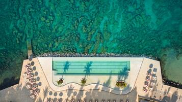 2 indoor pools, seasonal outdoor pool, pool umbrellas, pool loungers