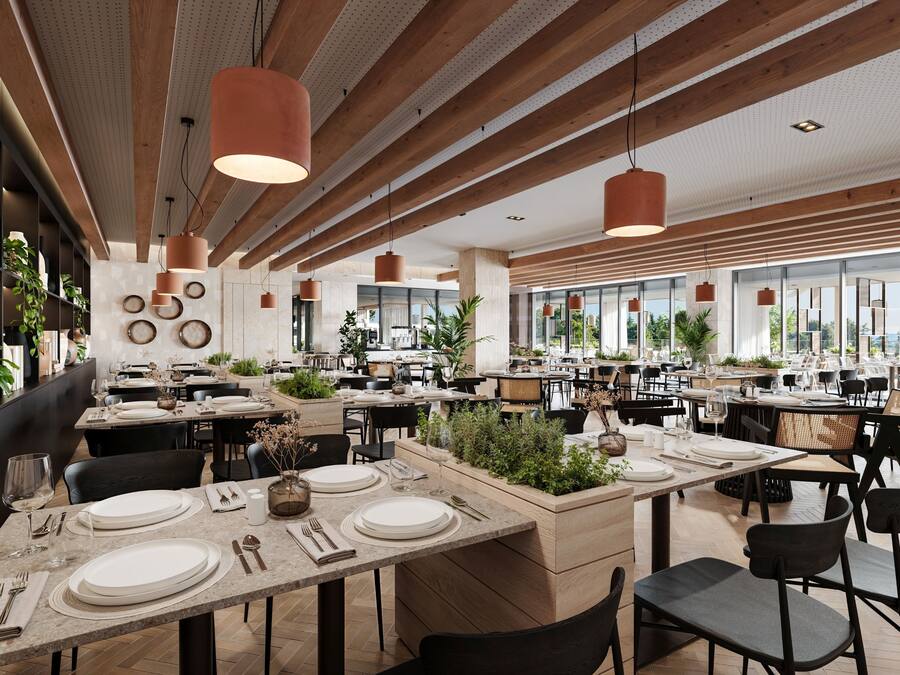 A spacious restaurant with multiple dining areas, wooden beams, pendant lighting, and large windows offering views of the outdoors.