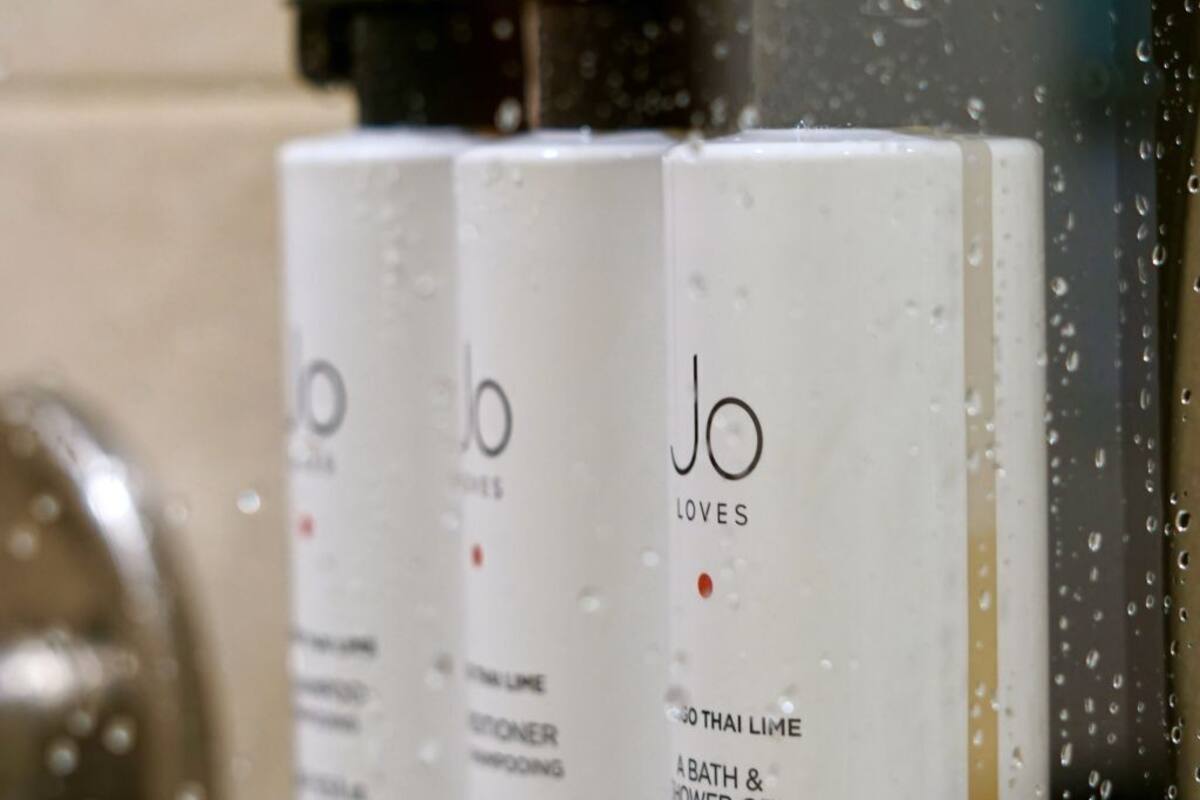 separate bathtub and shower, deep-soaking bathtub, designer toiletries