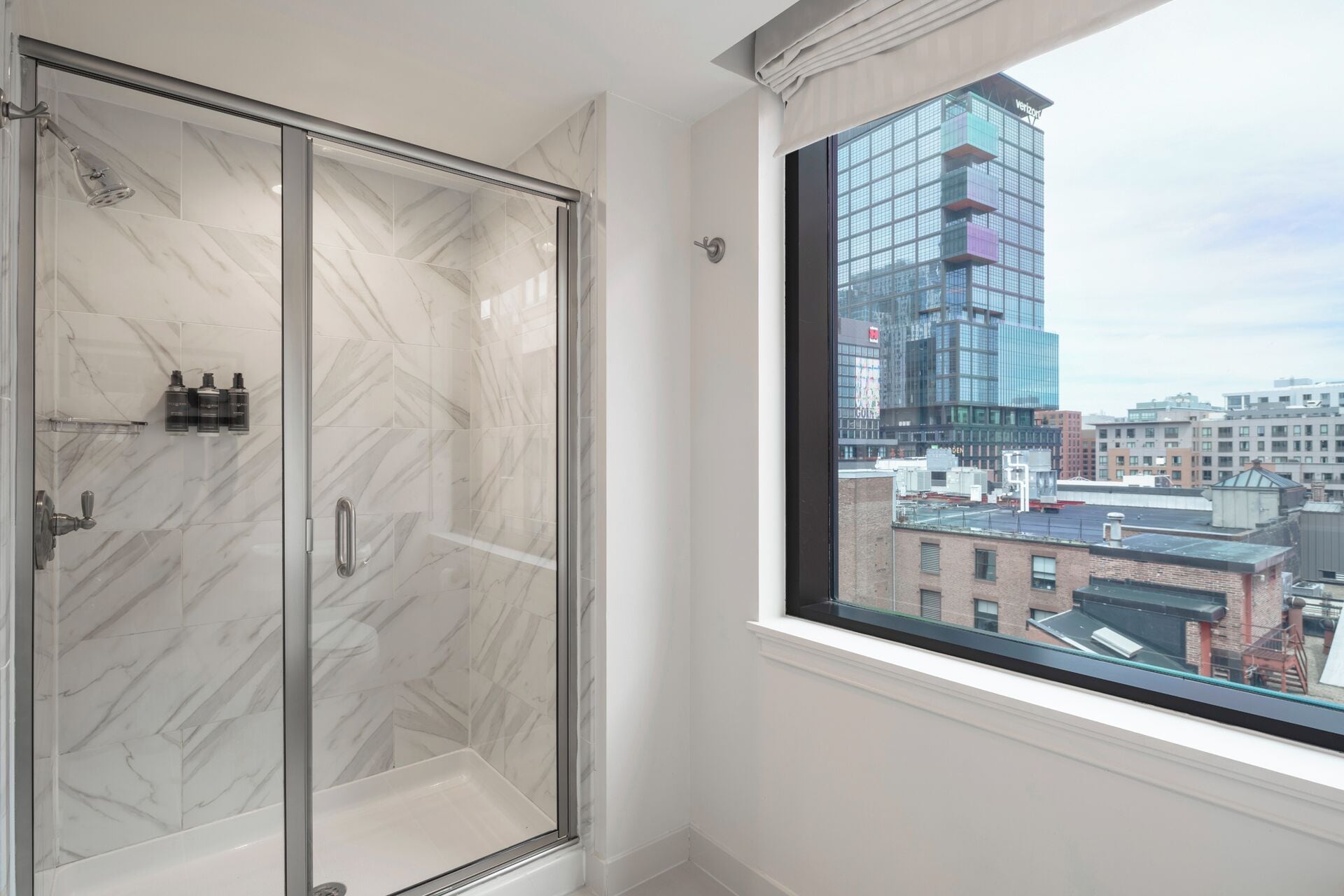 designer toiletries, hair dryer, bathrobes, slippers