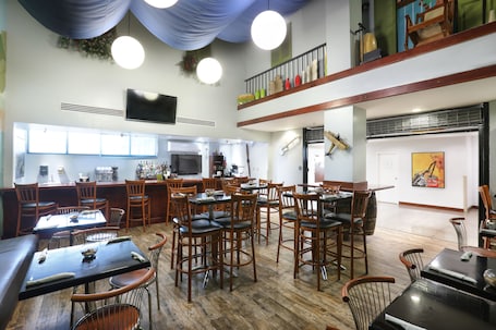 Lunch and dinner served, Latin American cuisine. San Juan Airport Hotel