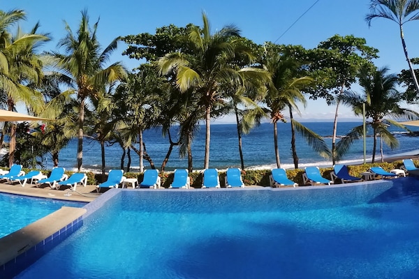 2 outdoor pools, open 5:00 AM to 10:00 PM, pool umbrellas, pool loungers