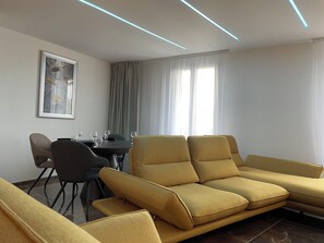 Deluxe Apartment, 3 Bedrooms | Living area | TV - Brit Hotel de Grignan (Vichy)