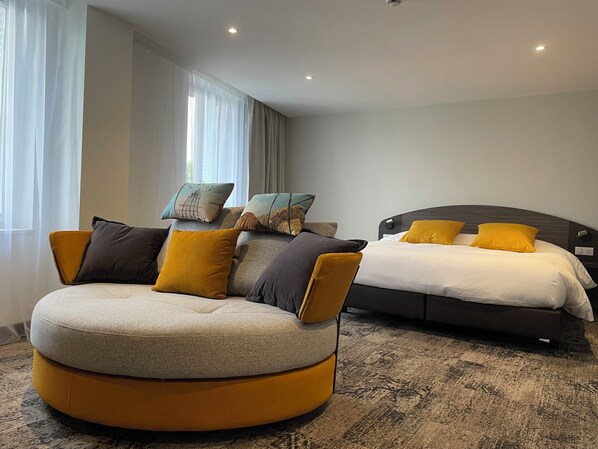 Deluxe Apartment, 3 Bedrooms | Living area | TV - Brit Hotel de Grignan (Vichy)