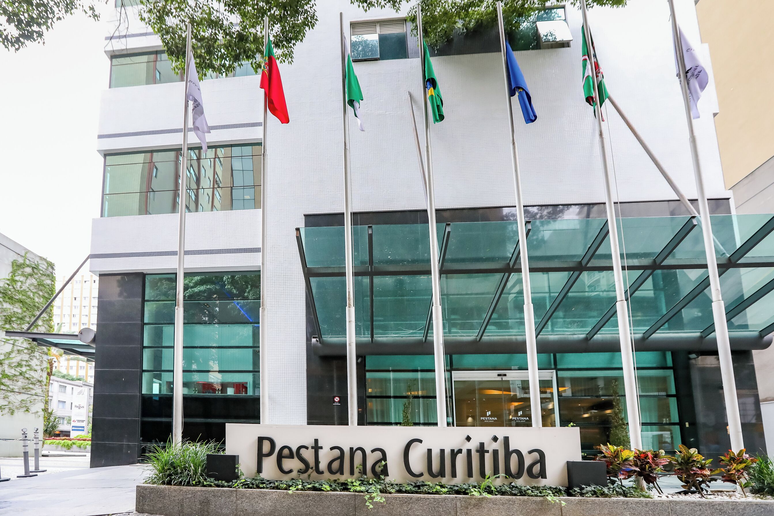 A building with a sign reading "Pestana Curitiba."