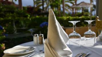A table set for dining with a folded napkin, cutlery, and glassware.
