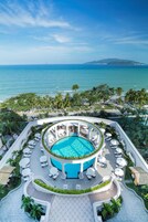 Outdoor pool, open 6:00 AM to 6:00 PM, pool umbrellas, sun loungers