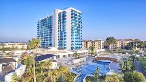 A hotel with a large pool, multiple balconies, and a surrounding garden. - BG Hotel Tonga Tower (Santa Margalida)