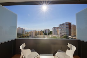 Relax and dine on the balcony with a clear view of the city.