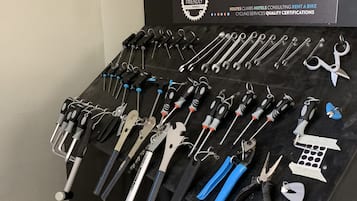 A display of tools on a black stand with a Cycling-Friendly.com logo.
