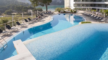 Indoor pool, outdoor pool, pool umbrellas, pool loungers