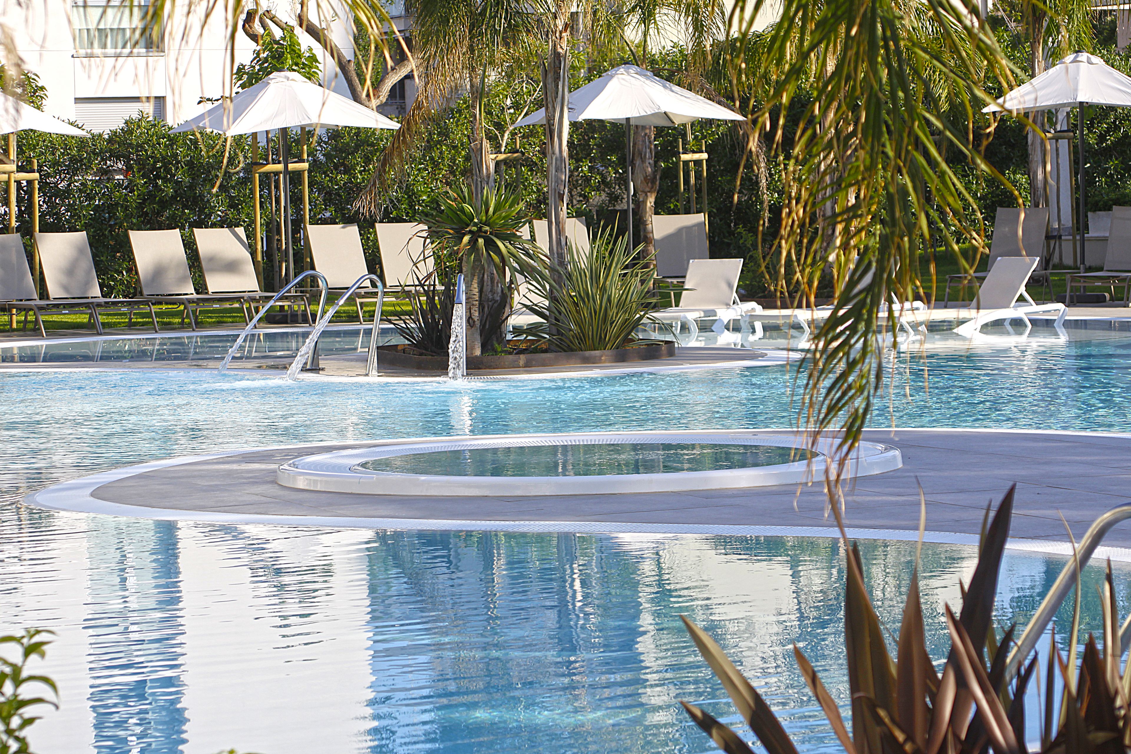 indoor pool, outdoor pool, open 8:00 am to 7:00 pm, pool umbrellas