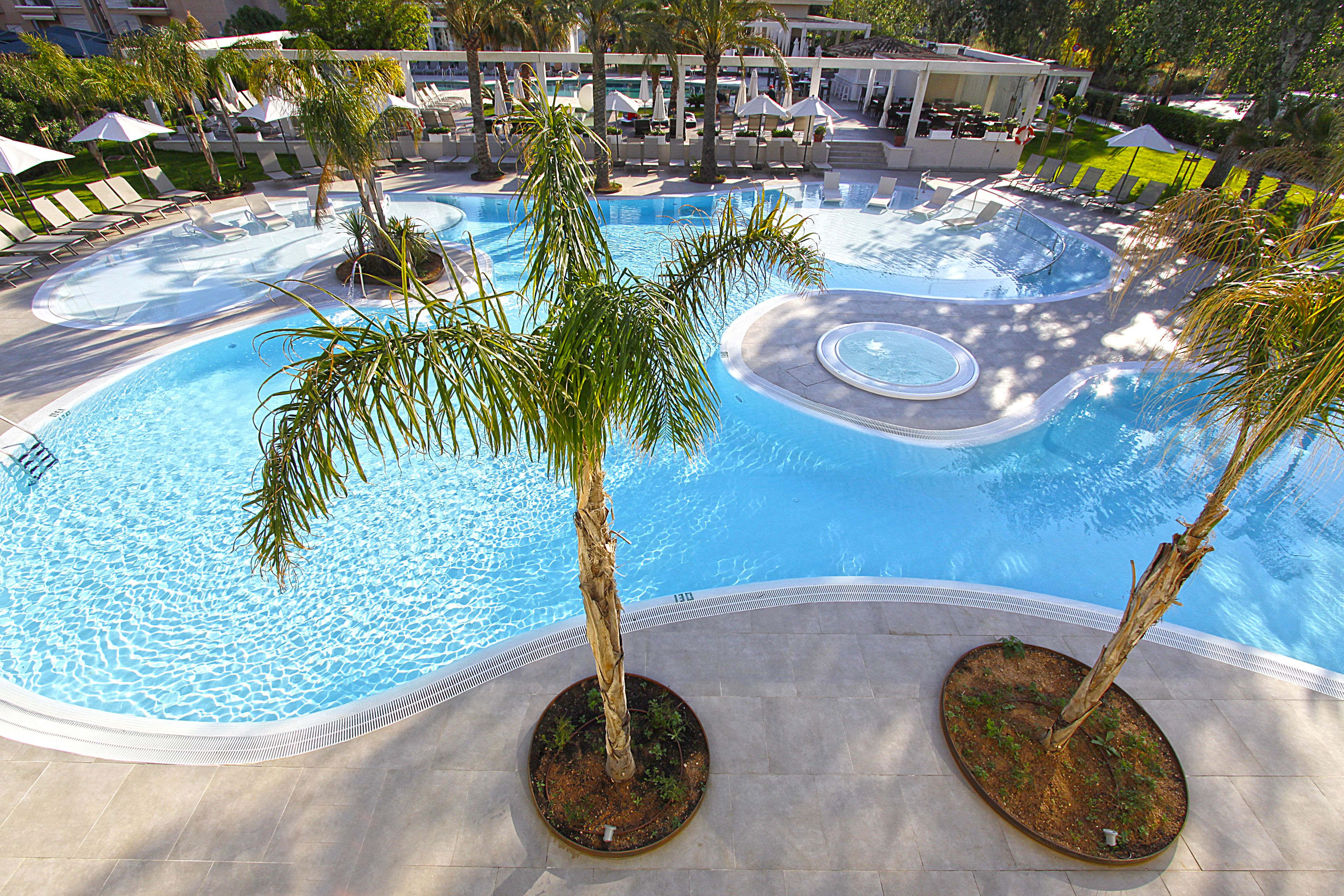 indoor pool, outdoor pool, open 8:00 am to 7:00 pm, pool umbrellas