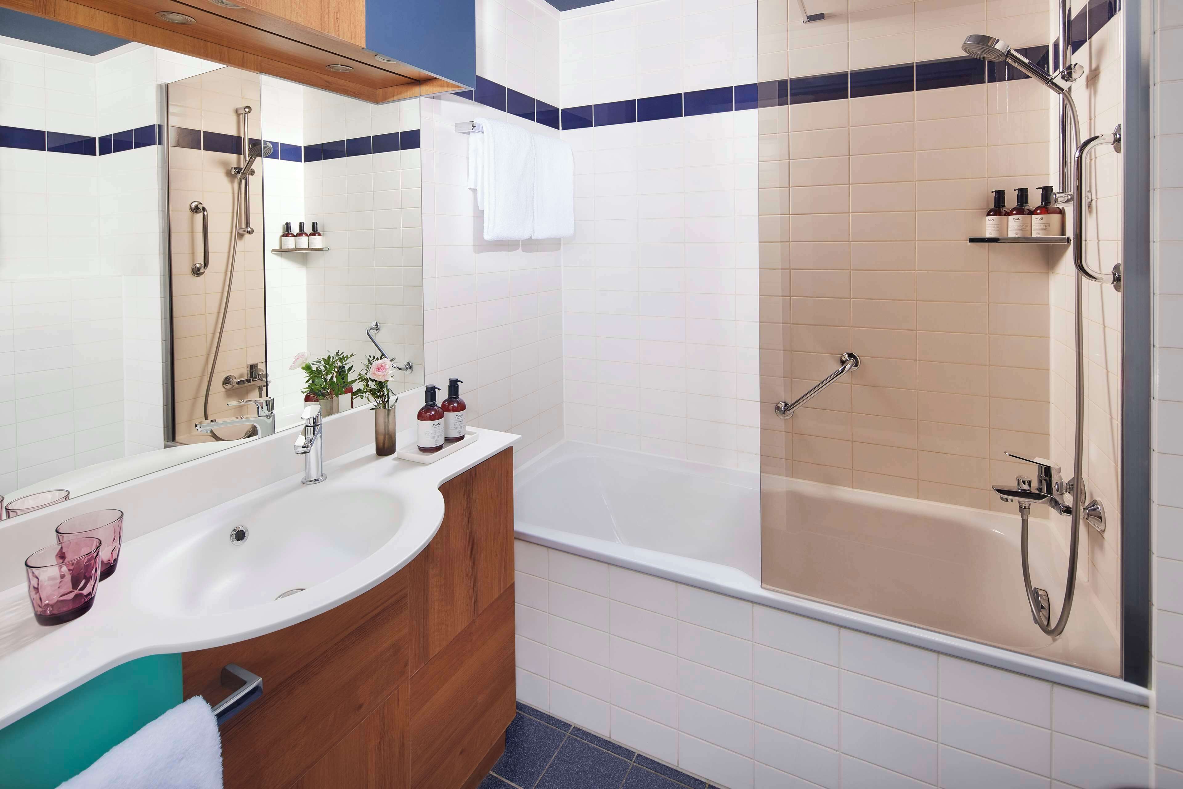 eco-friendly toiletries, hair dryer, towels, soap