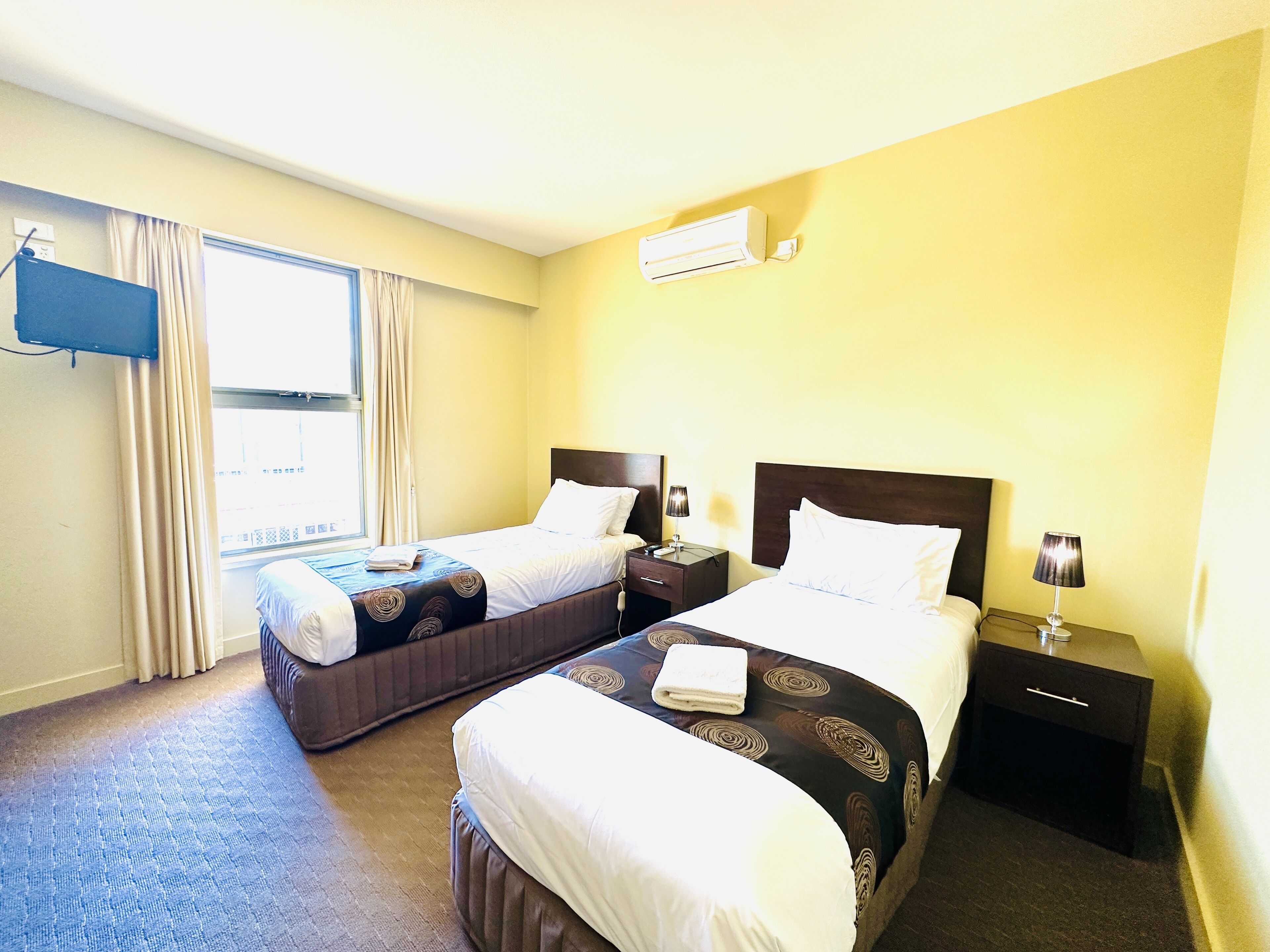 standard room, multiple beds, non smoking | desk, iron/ironing board, bed sheets, alarm clocks