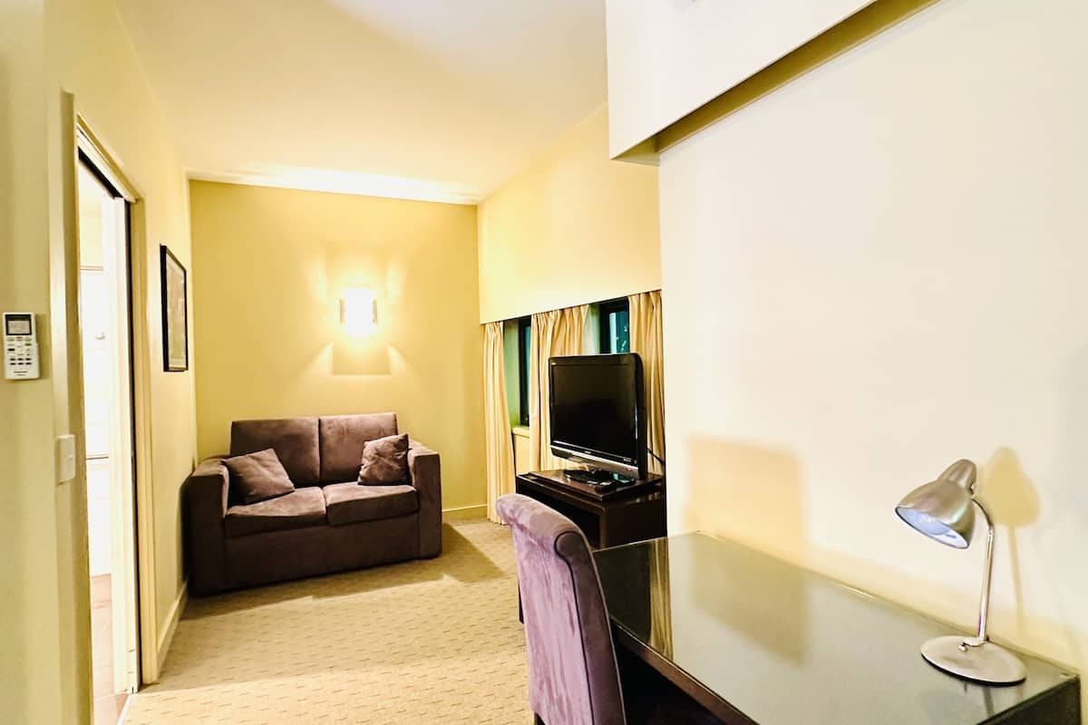 standard queen room | desk, iron/ironing board, bed sheets, alarm clocks