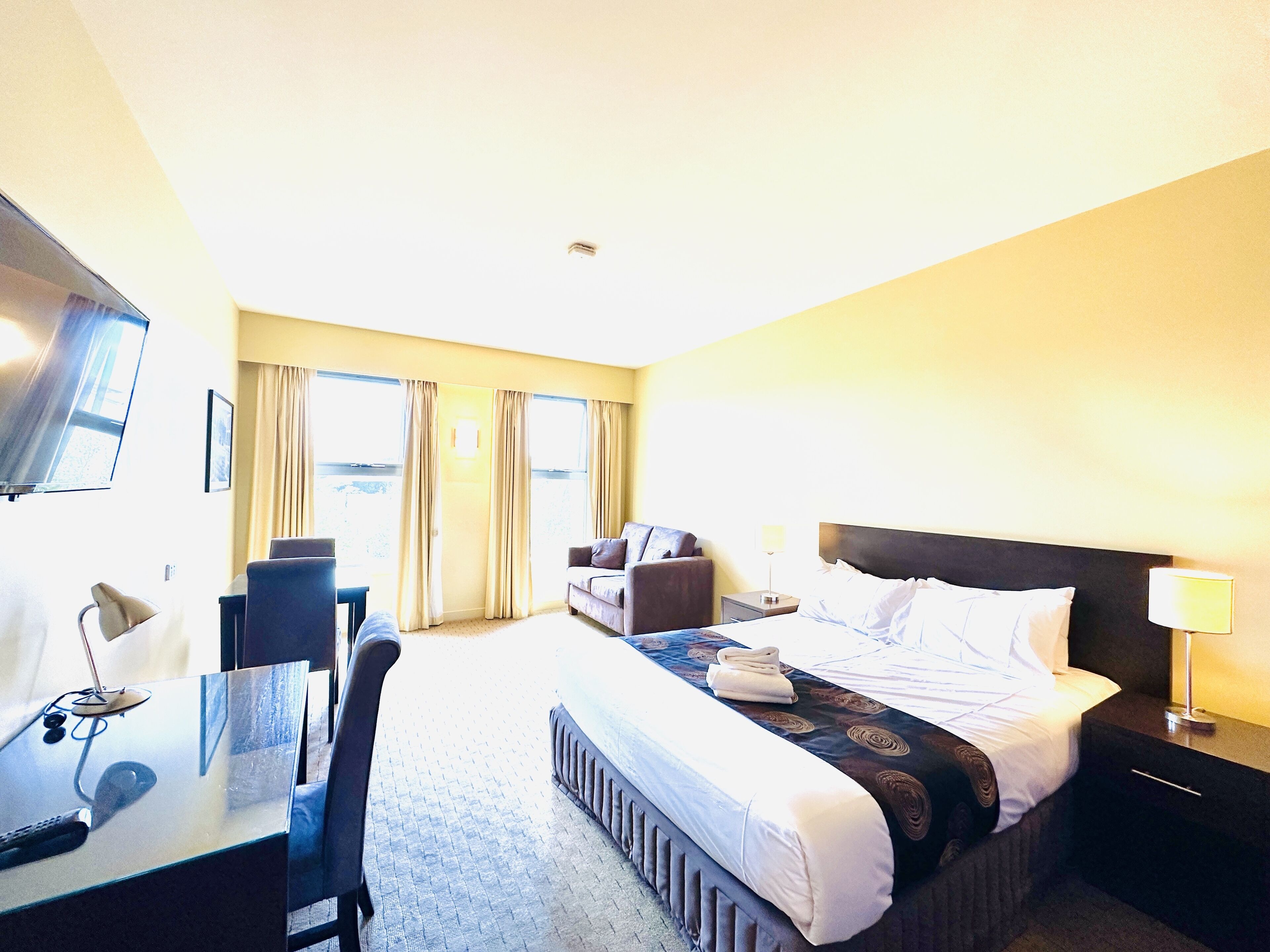 standard queen room | desk, iron/ironing board, bed sheets, alarm clocks